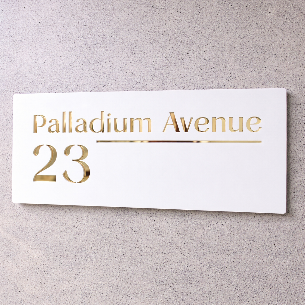White sign with gold text 'Palladium Avenue 23' on a gray background