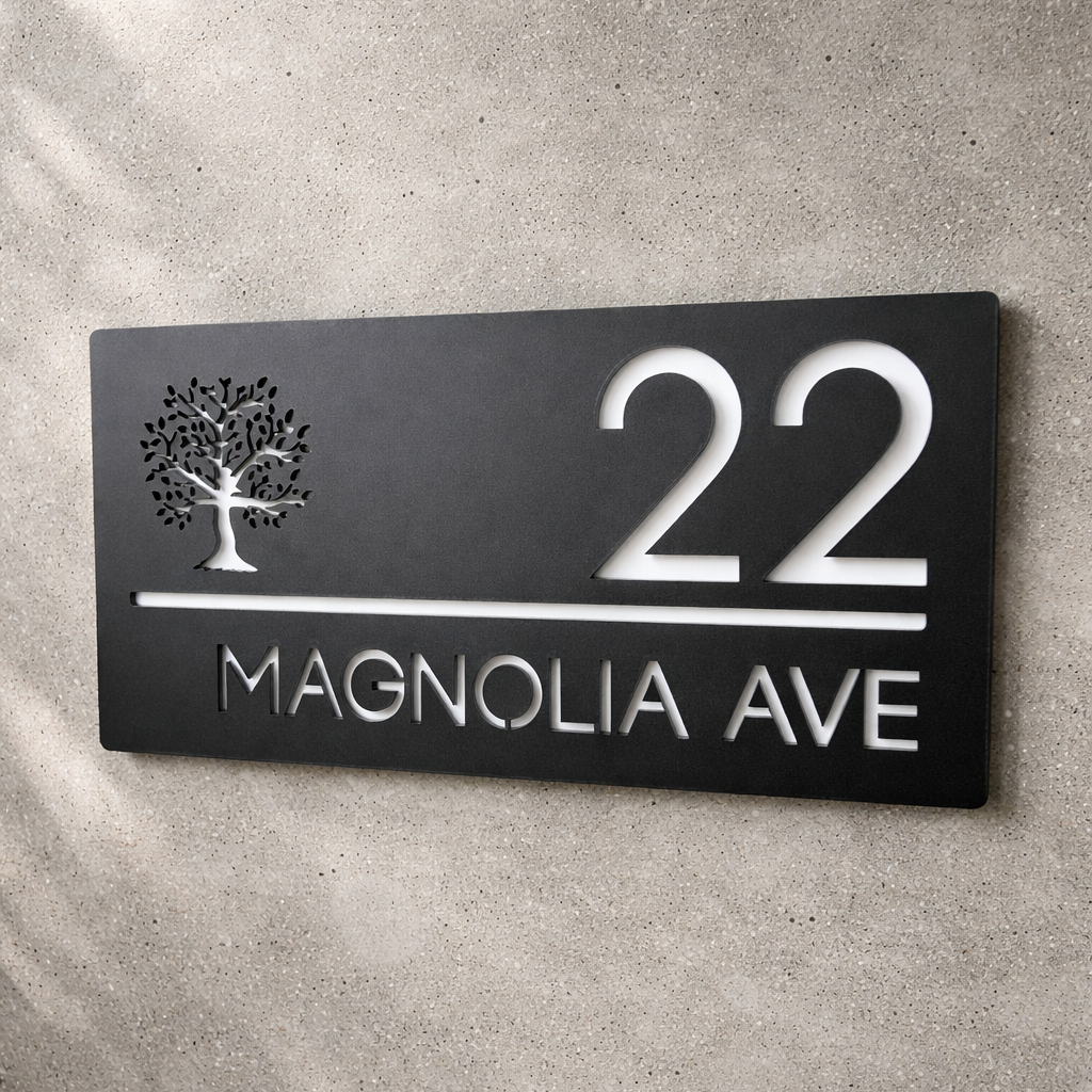 House number sign '22 Magnolia Ave' on a concrete wall