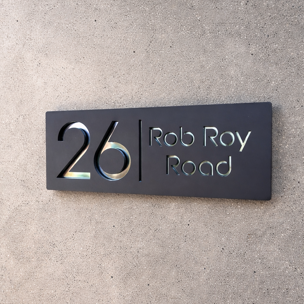 Modern house number sign on a concrete wall