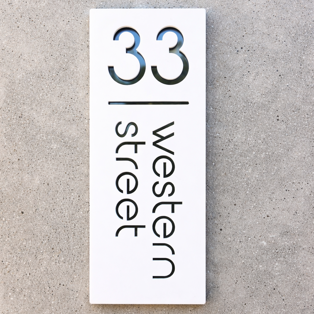 Rectangular sign with '33 Western Street' text on a gray background