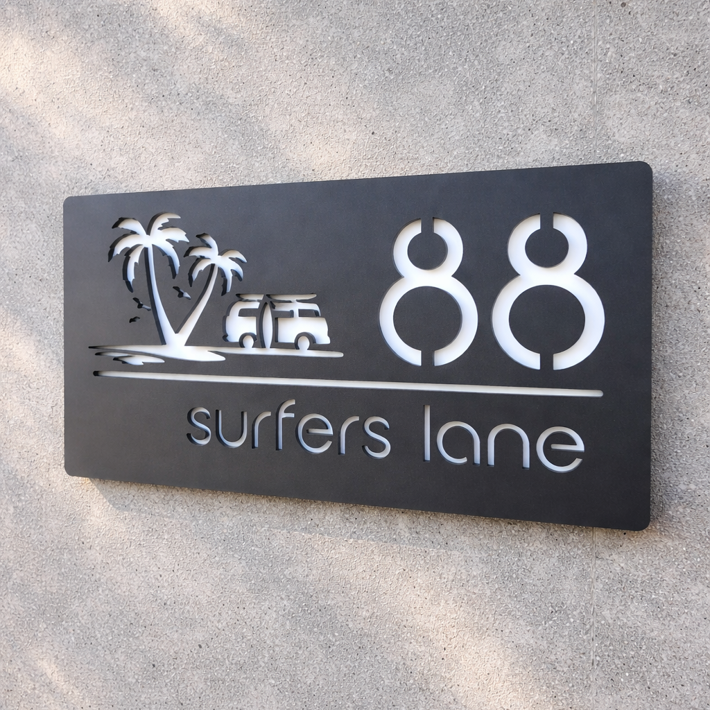 House sign with palm trees and the number 88 on a concrete wall