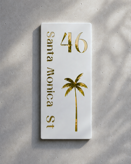 White card with gold text and palm tree design on a gray background