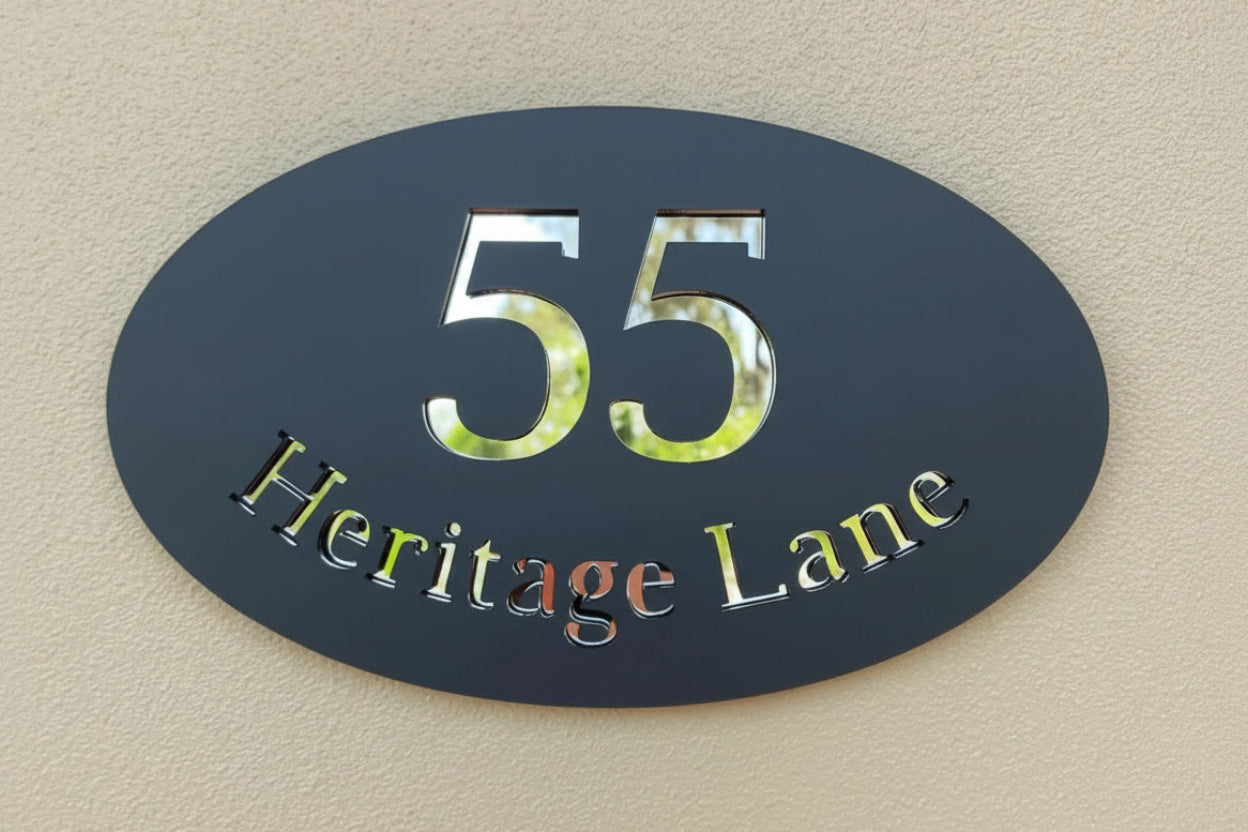 House number sign with '55 Heritage Lane' on a beige wall